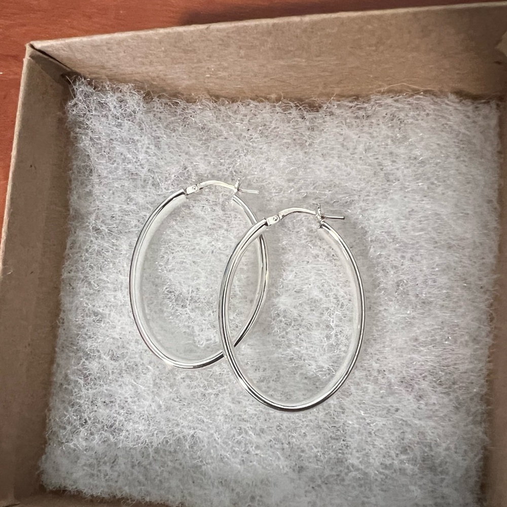 SOLD. Macy’s polished oval hoop earrings, sterling silver